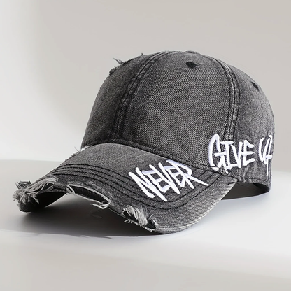 Distressed Denim Cap with “Never Give Up” Stitching